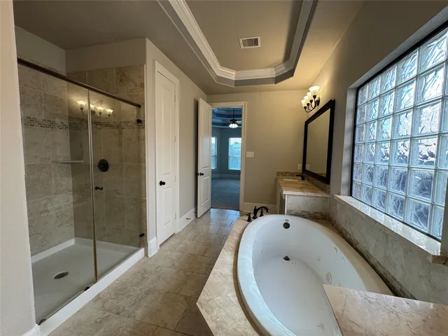 a bathroom with a bathtub and a sink