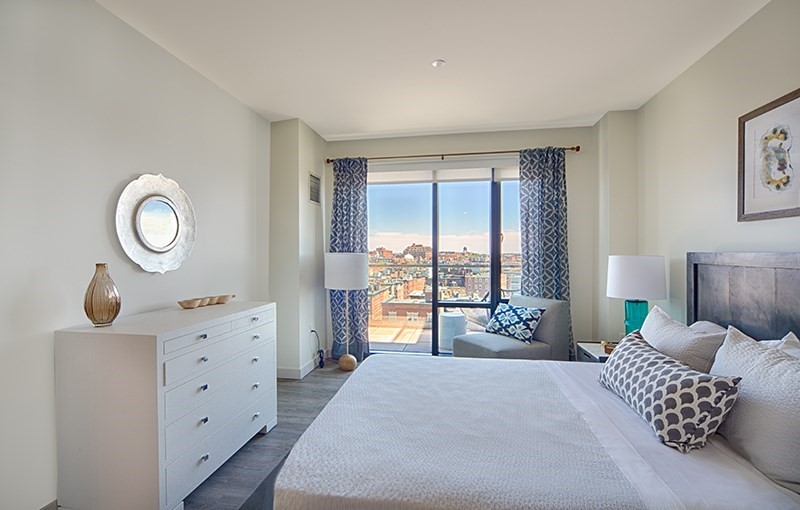 1 Canal Street, Unit 1012 Boston, MA 02114 - Photo 4 of 12 a bedroom with a bed and a large window