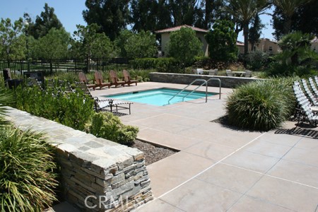 3 Leucadia Irvine, CA 92602 - Photo 16 of 30 a swimming pool with outdoor seating and lake