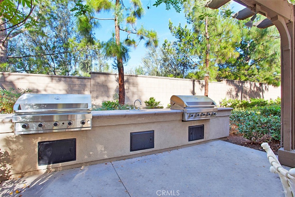 3 Leucadia Irvine, CA 92602 - Photo 24 of 30 a stove top oven sitting next to a yard