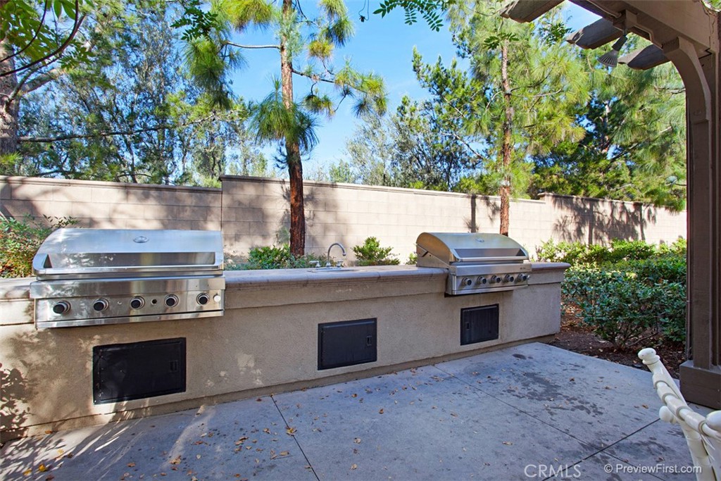 3 Leucadia Irvine, CA 92602 - Photo 28 of 30 a stove top oven sitting next to a yard