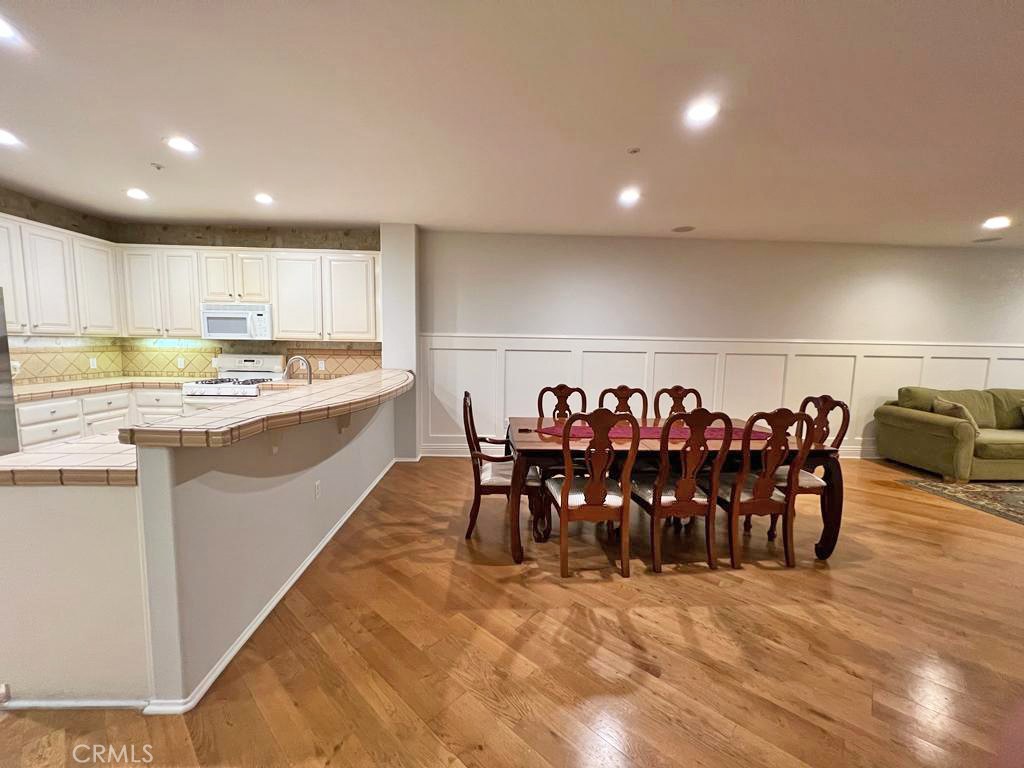 3 Leucadia Irvine, CA 92602 - Photo 5 of 30 a large kitchen with a table and chairs