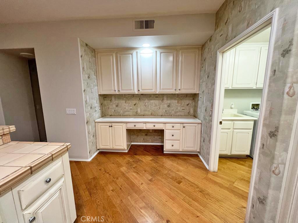 3 Leucadia Irvine, CA 92602 - Photo 6 of 30 a kitchen with granite countertop a stove a sink and a refrigerator