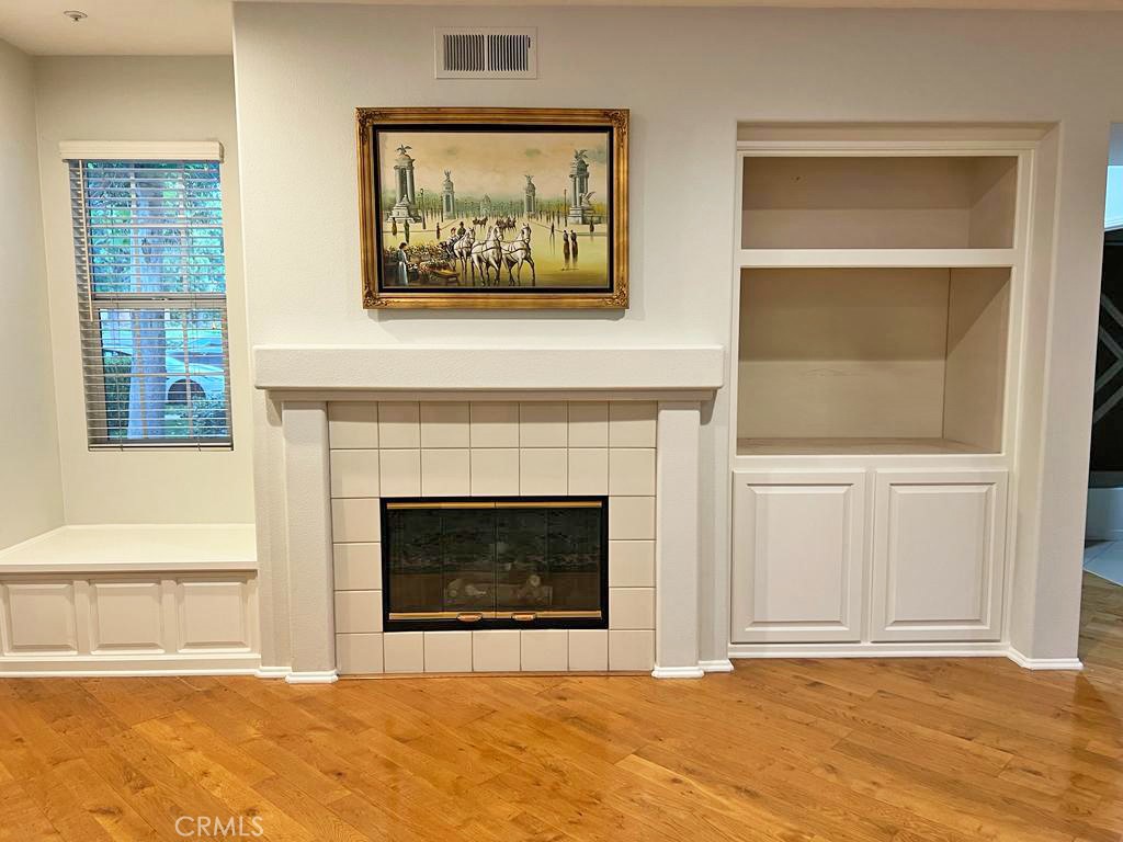 3 Leucadia Irvine, CA 92602 - Photo 7 of 30 a view of an empty room with a fireplace and a window