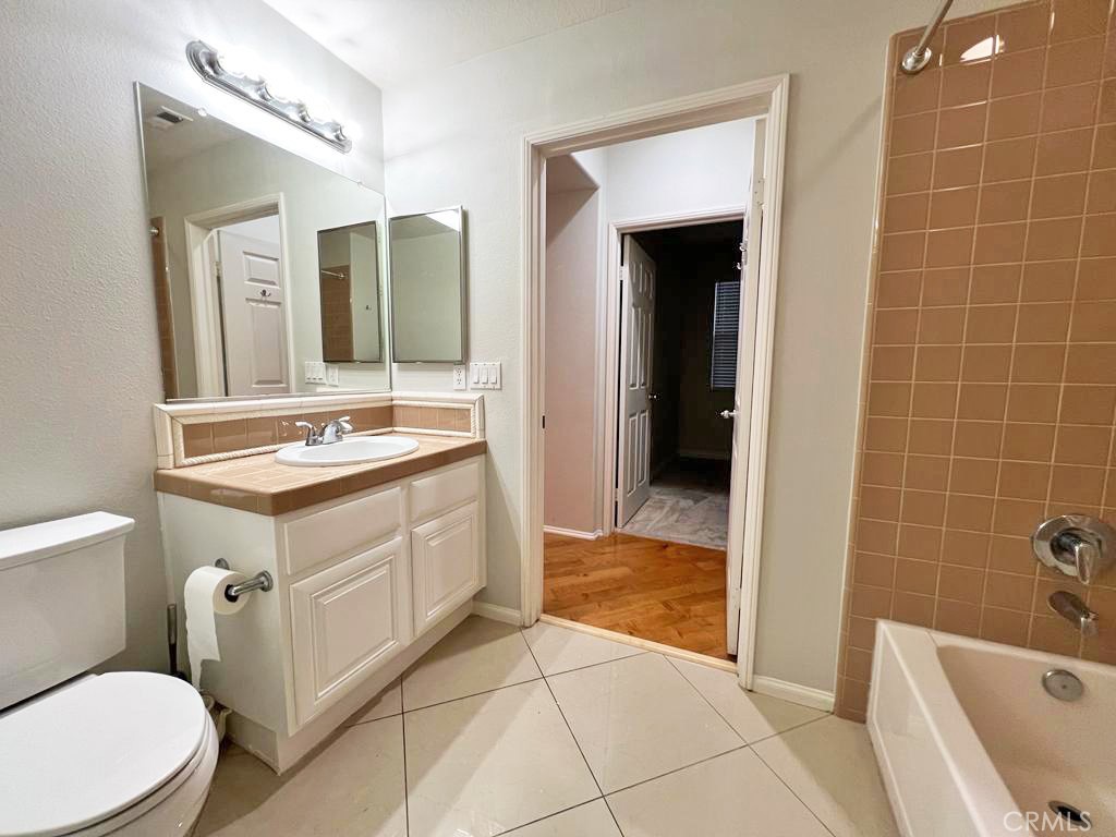3 Leucadia Irvine, CA 92602 - Photo 10 of 30 a bathroom with a sink a toilet and shower
