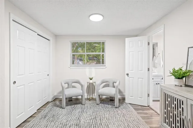 a bedroom with furniture and a window