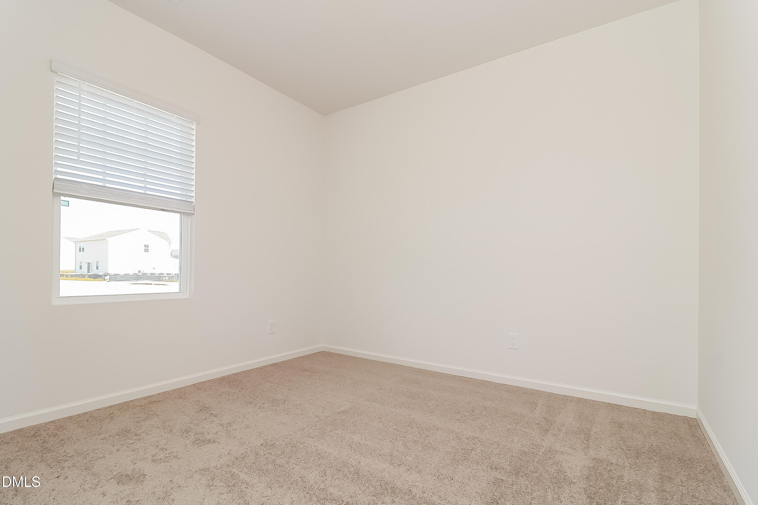 172 Ogden Pond Place Zebulon, NC 27597 - Photo 12 of 16 an empty room with a window