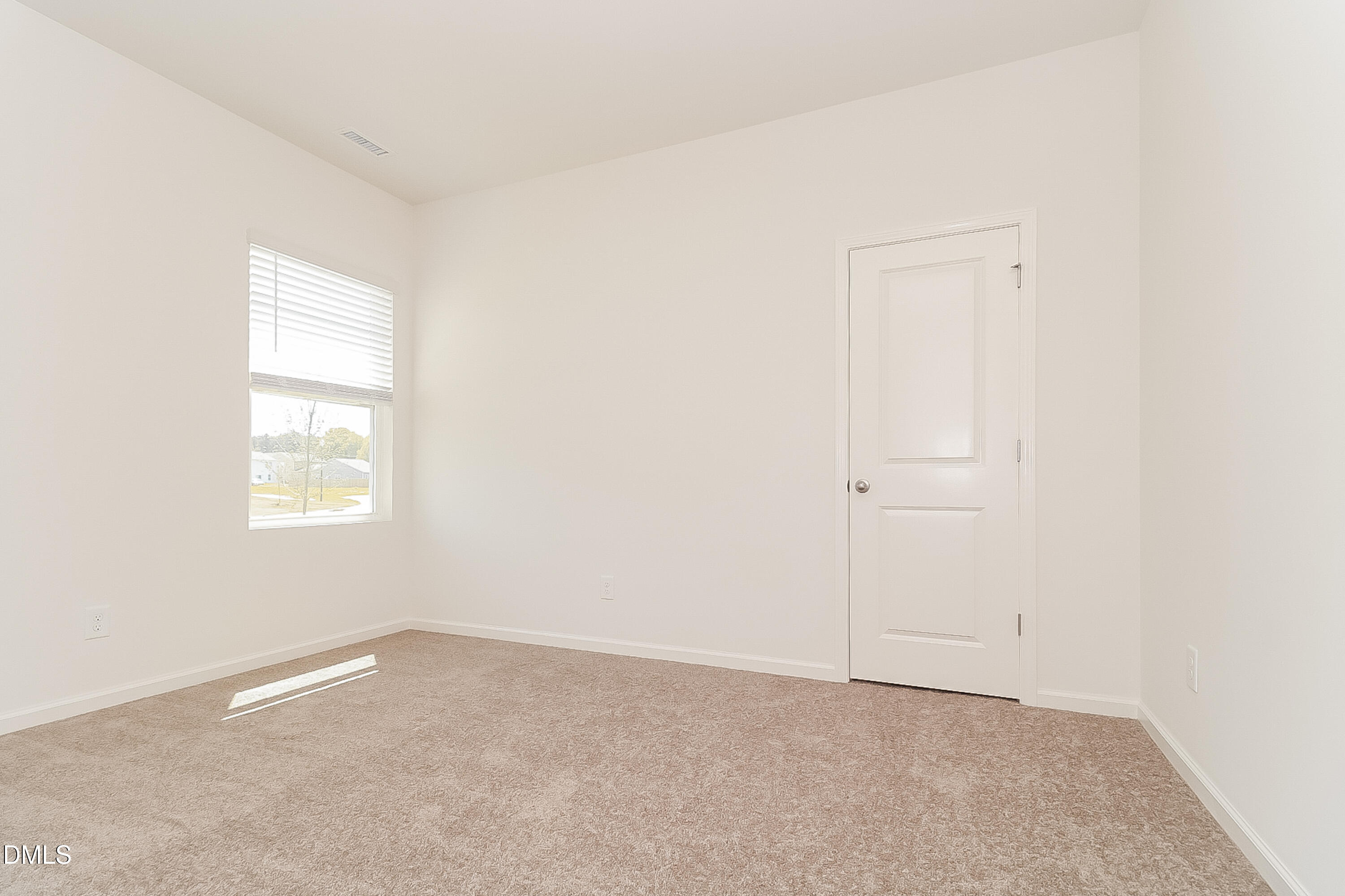 172 Ogden Pond Place Zebulon, NC 27597 - Photo 13 of 16 an empty room with a window