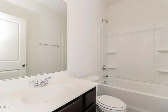 a bathroom with a sink toilet and a bathtub