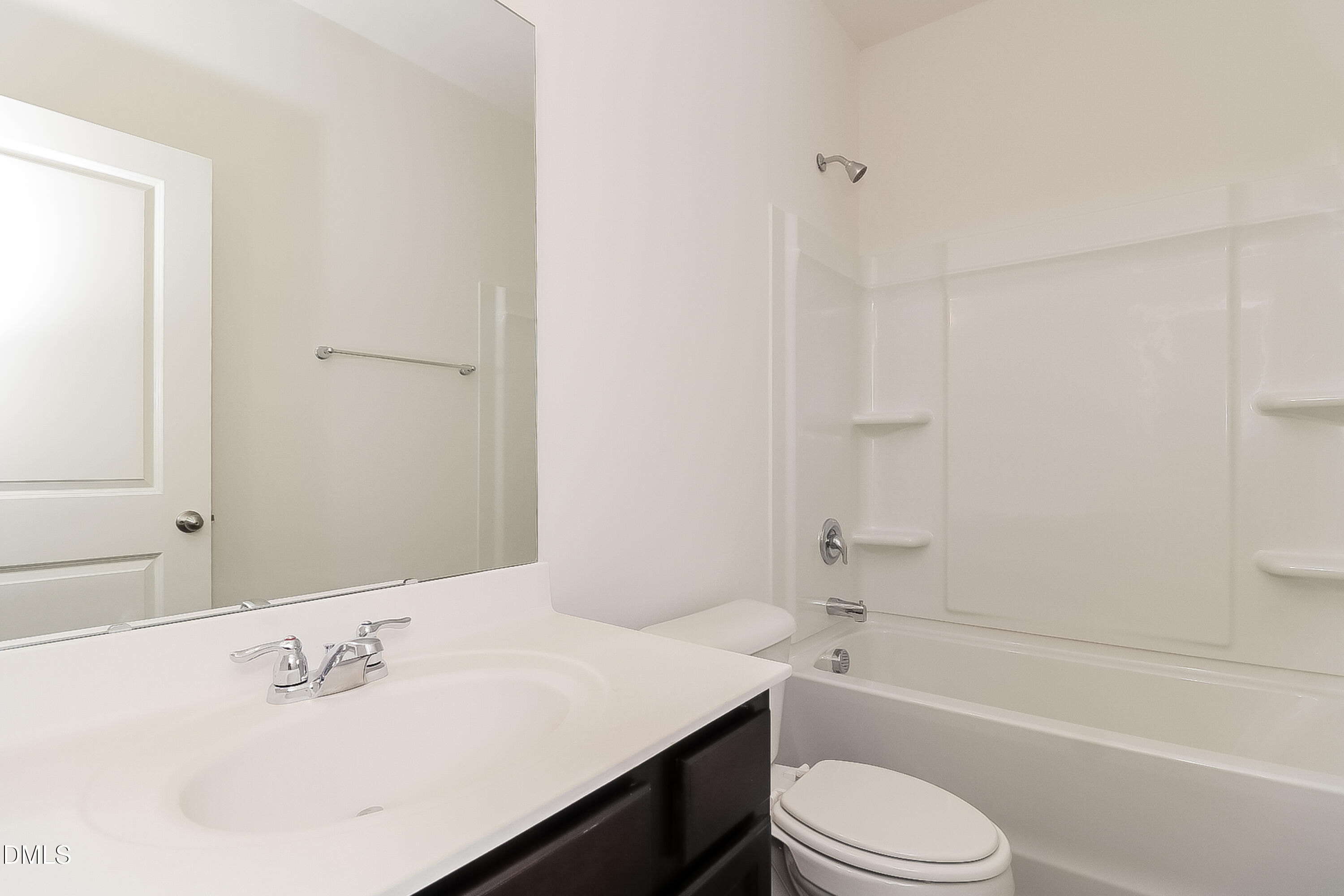 172 Ogden Pond Place Zebulon, NC 27597 - Photo 14 of 16 a bathroom with a sink toilet and a bathtub