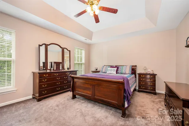 a bed room with a bed and a dresser