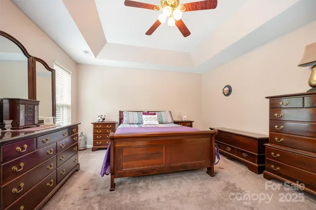 a room with a bed and a television