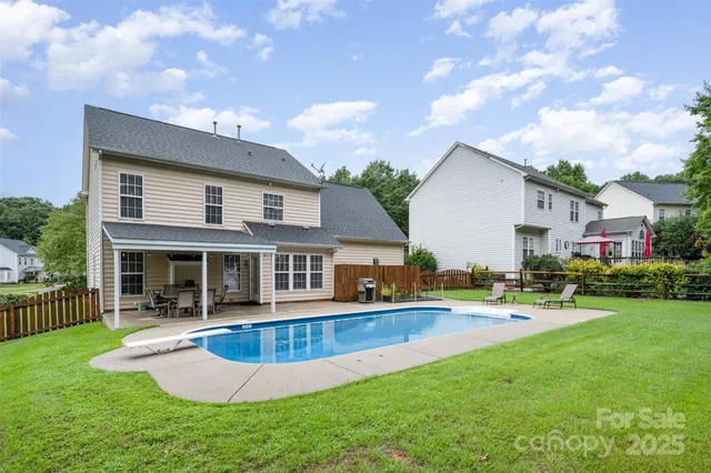 a view of a house with a yard patio and a patio