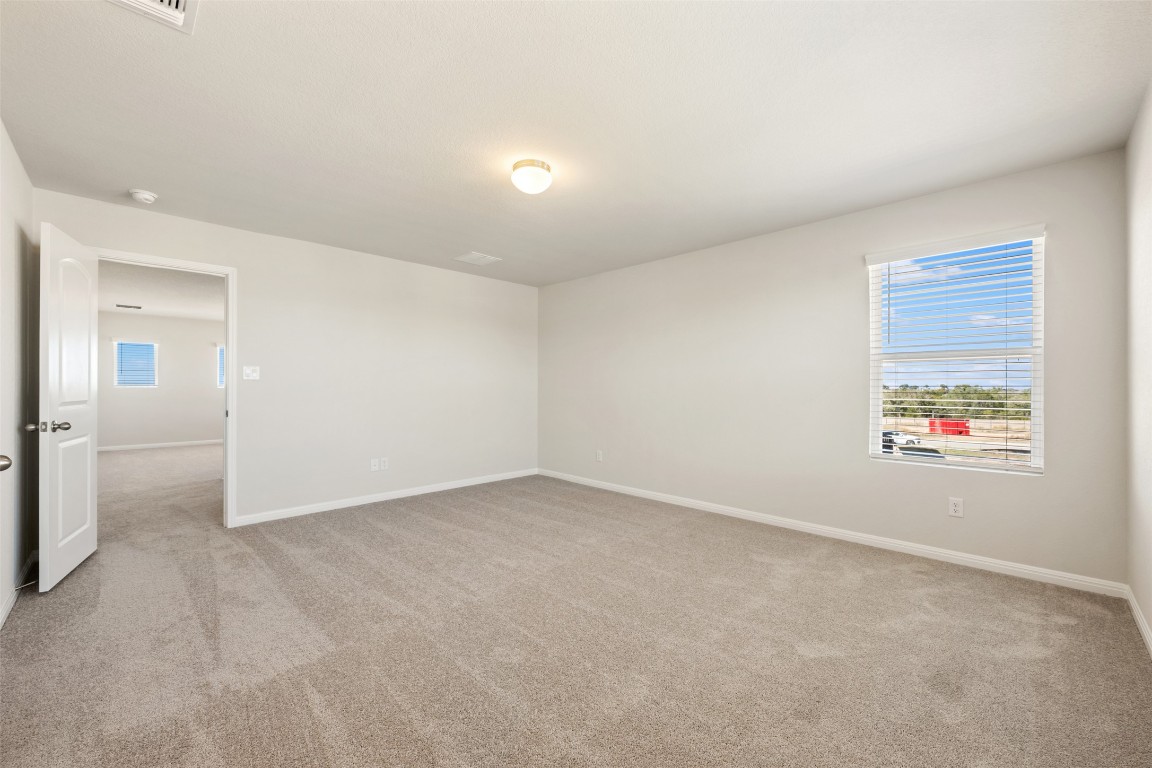 135 Silverleaf Spur Bastrop, TX 78602 - Photo 30 of 40 an empty room with windows