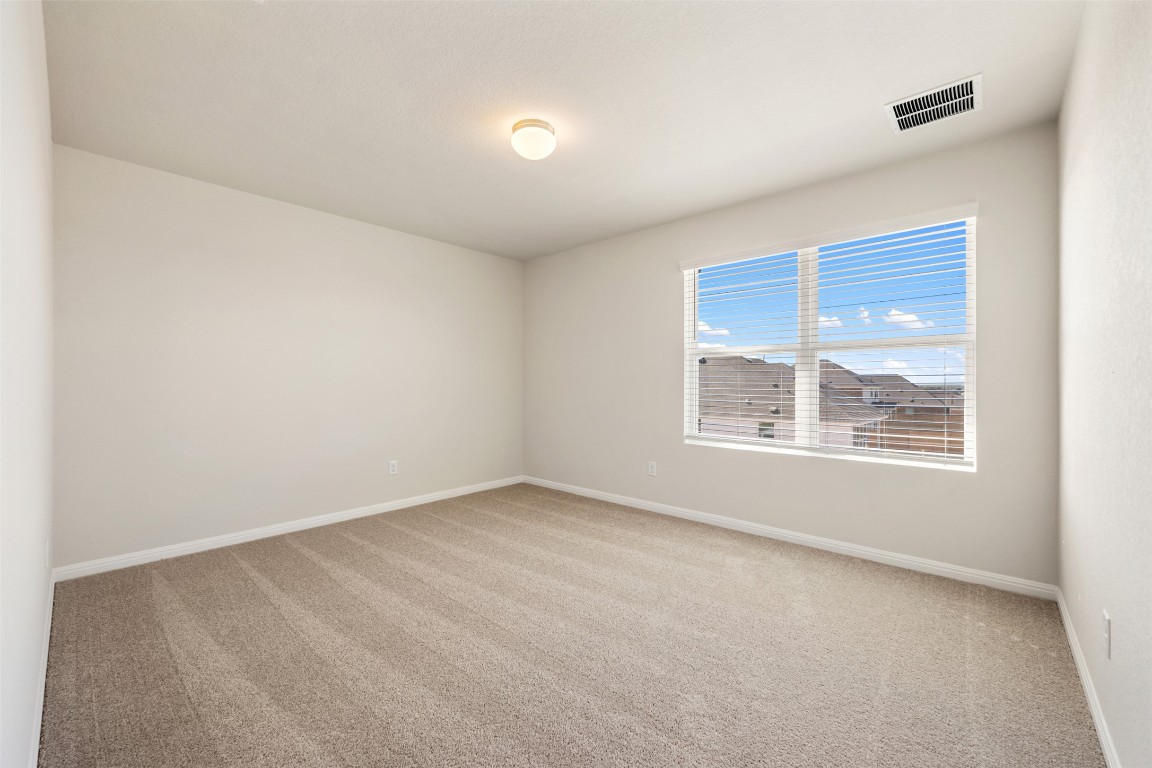 135 Silverleaf Spur Bastrop, TX 78602 - Photo 36 of 40 an empty room with a window
