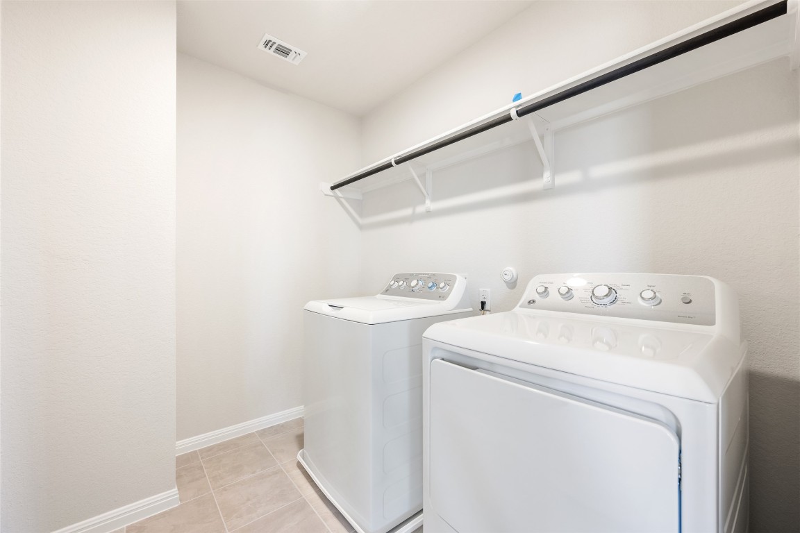 135 Silverleaf Spur Bastrop, TX 78602 - Photo 38 of 40 a utility room with dryer and washer