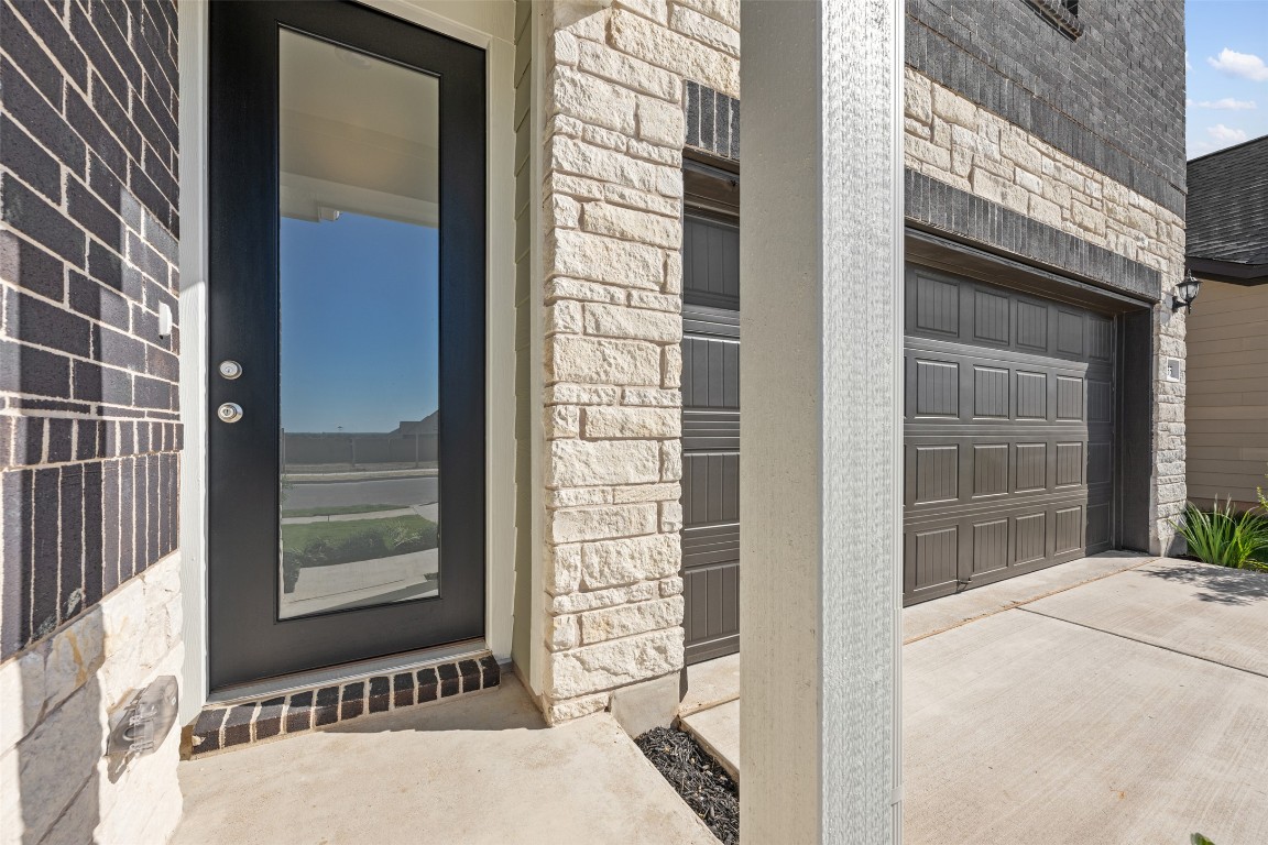 135 Silverleaf Spur Bastrop, TX 78602 - Photo 5 of 40 a front view of a house having yard