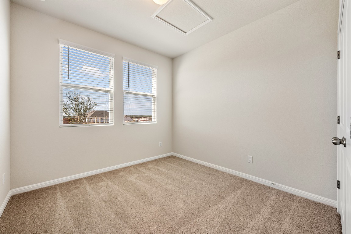 135 Silverleaf Spur Bastrop, TX 78602 - Photo 7 of 40 an empty room with windows