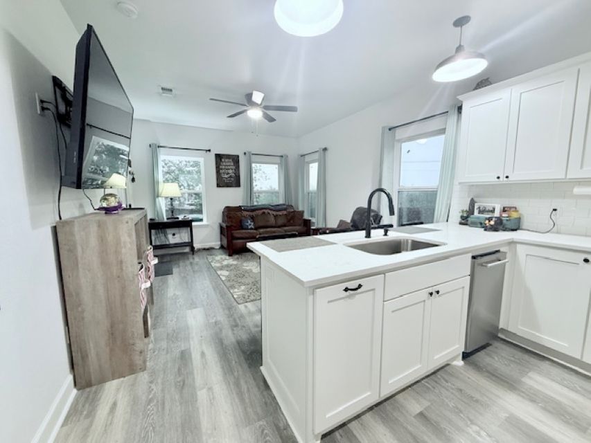 810 Brown Street Brenham, TX 77833 - Photo 15 of 36 a kitchen with stainless steel appliances a sink stove and refrigerator