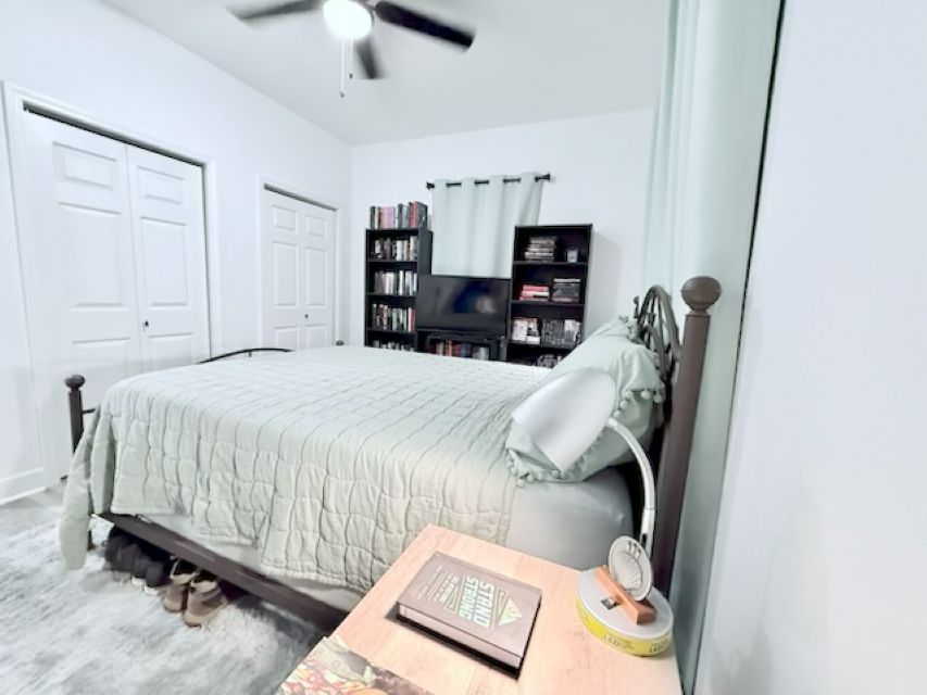 810 Brown Street Brenham, TX 77833 - Photo 18 of 36 a bedroom with a bed and dresser