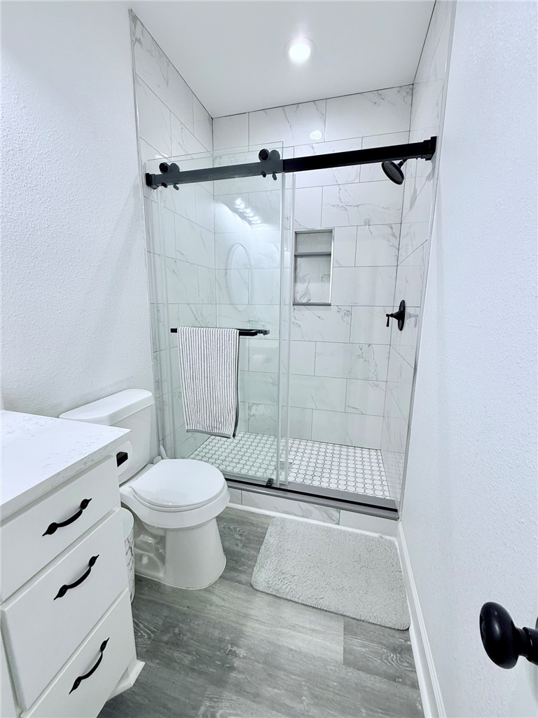810 Brown Street Brenham, TX 77833 - Photo 20 of 36 a bathroom with a toilet and a shower