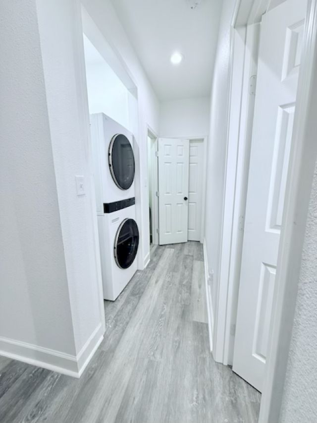 810 Brown Street Brenham, TX 77833 - Photo 21 of 36 a room with wooden floor and washing machine