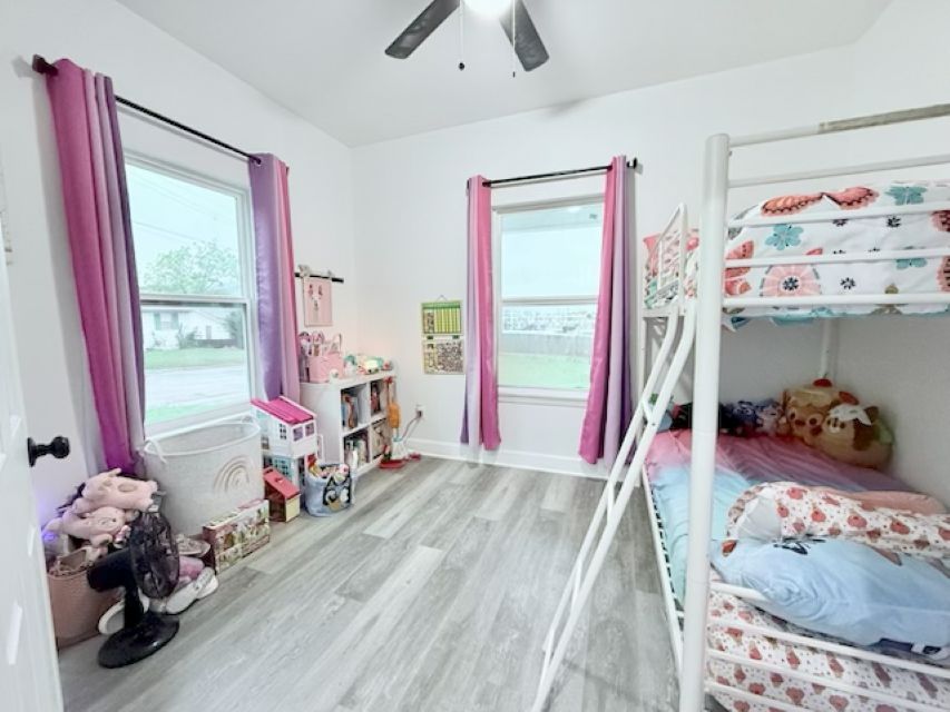 810 Brown Street Brenham, TX 77833 - Photo 24 of 36 a living room with furniture and a large window