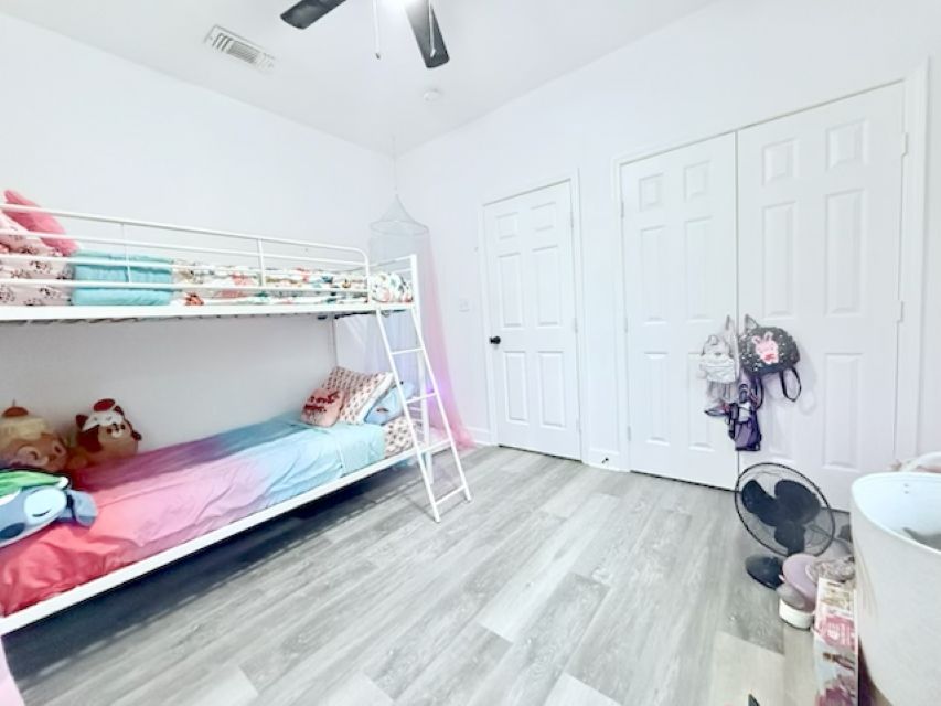 810 Brown Street Brenham, TX 77833 - Photo 25 of 36 a bed room with a bed and a couch