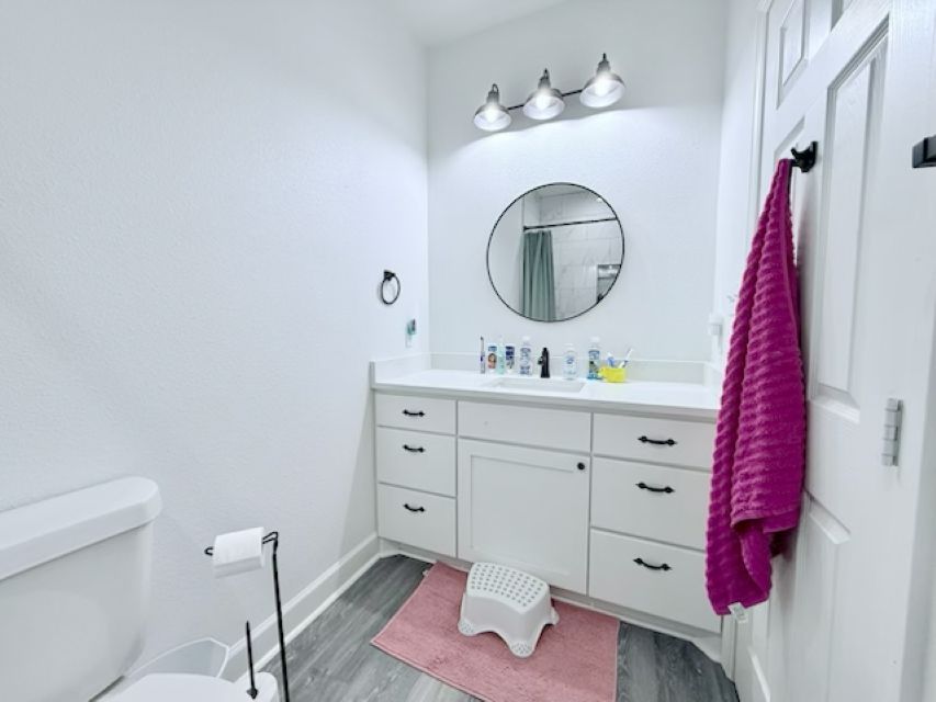 810 Brown Street Brenham, TX 77833 - Photo 27 of 36 a bathroom with a sink vanity and mirror