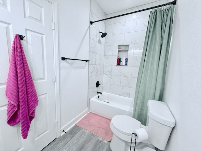 810 Brown Street Brenham, TX 77833 - Photo 28 of 36 a bathroom with a sink toilet and shower