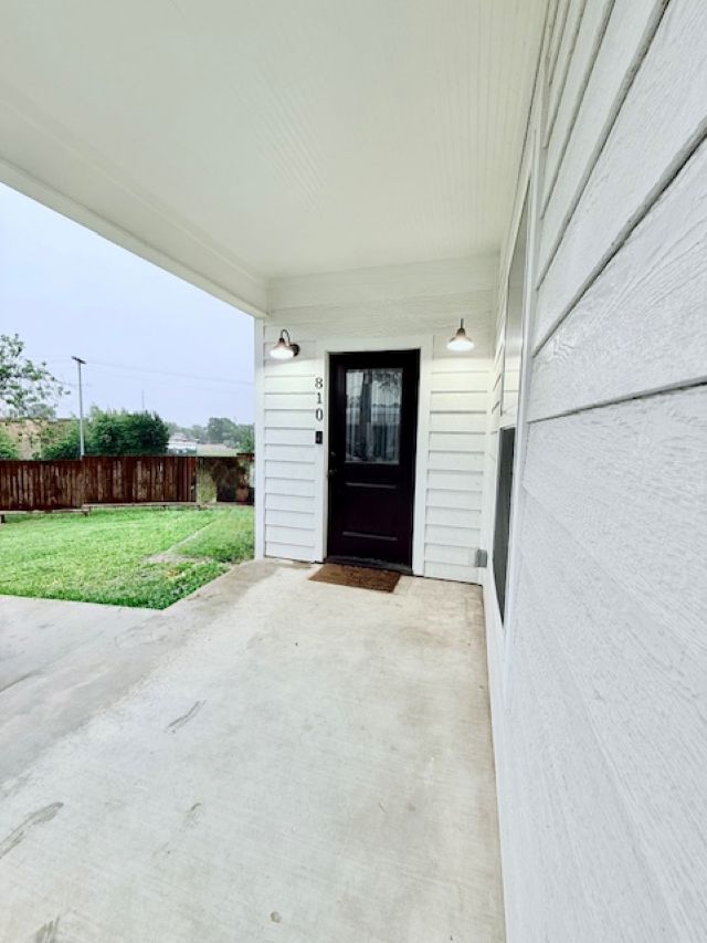 810 Brown Street Brenham, TX 77833 - Photo 4 of 36 a view of a porch with a garage