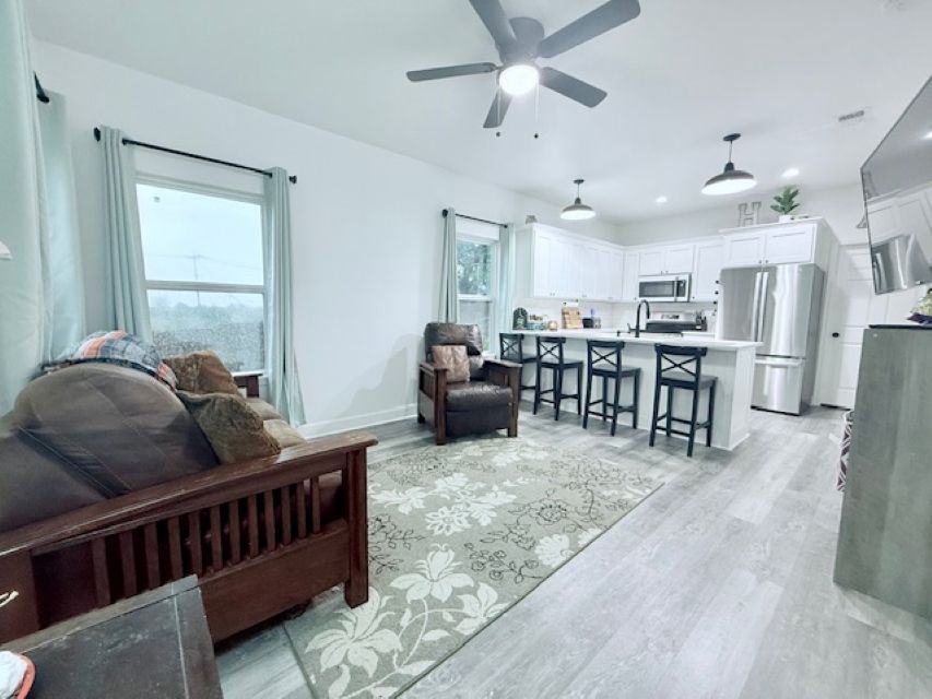 810 Brown Street Brenham, TX 77833 - Photo 5 of 36 a living room with furniture and a large window