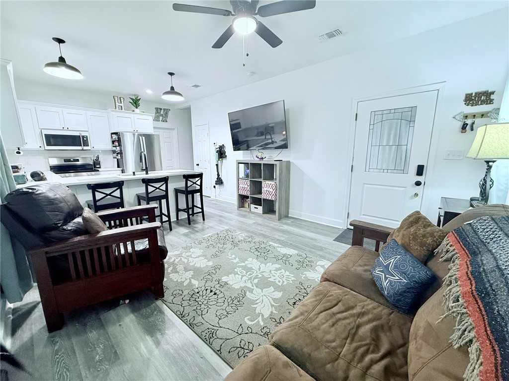 810 Brown Street Brenham, TX 77833 - Photo 6 of 36 a living room with furniture and a flat screen tv