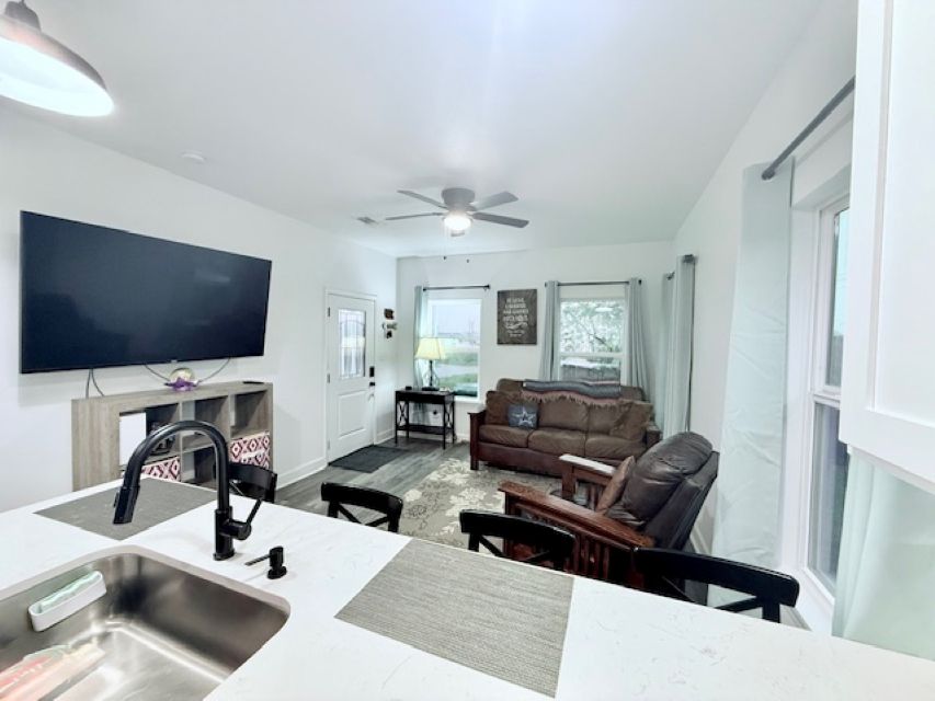 810 Brown Street Brenham, TX 77833 - Photo 7 of 36 a living room with furniture and a flat screen tv