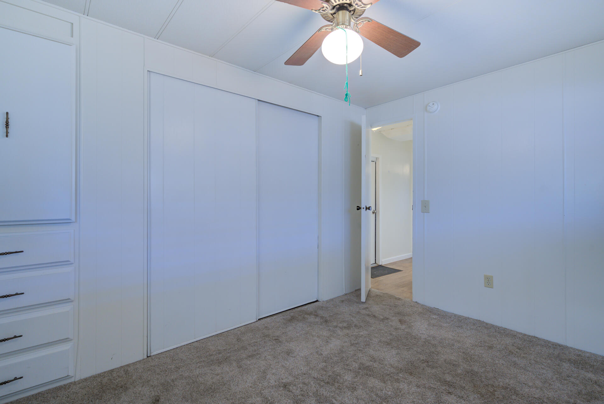 172 Casa Grande Drive Red Bluff, CA 96080 - Photo 13 of 24 an empty room with a chandelier fan and closet