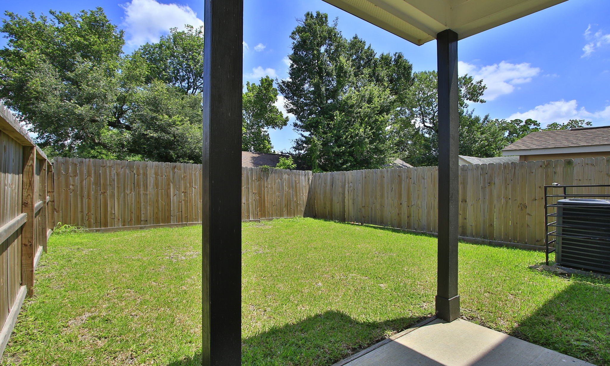 4337 Faulkner Street Houston, TX 77021 - Photo 32 of 39 a view of a backyard with a small cabin and wooden fence