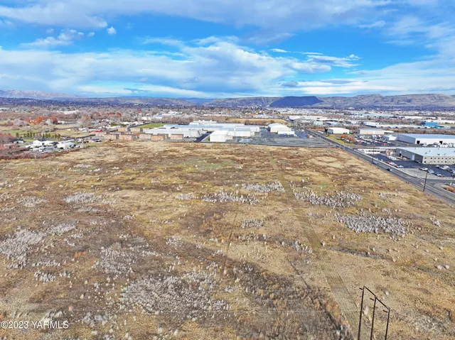 an aerial view of residential building and ocean