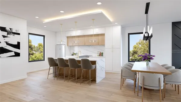 a kitchen with stainless steel appliances a stove and cabinets