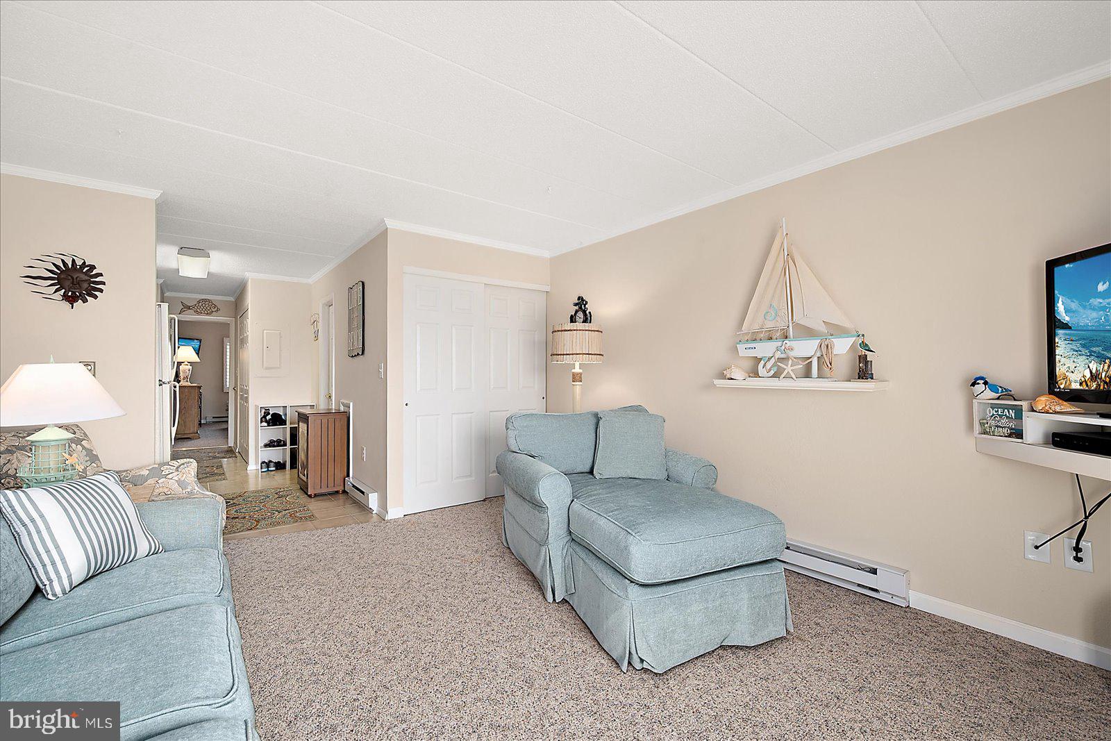 2 80th Street, Unit 504 Ocean City, MD 21842 - Photo 14 of 50 a living room with furniture and a couch
