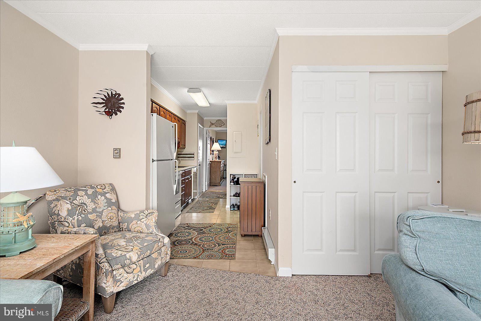 2 80th Street, Unit 504 Ocean City, MD 21842 - Photo 16 of 50 a living room with furniture and a baby crib