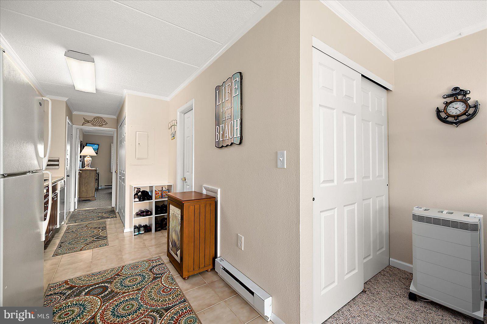 2 80th Street, Unit 504 Ocean City, MD 21842 - Photo 17 of 50 a view of a hallway with a kitchen