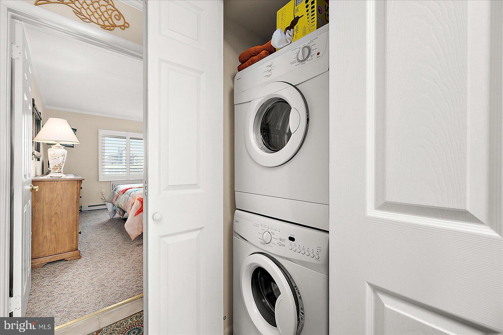 2 80th Street, Unit 504 Ocean City, MD 21842 - Photo 32 of 50 a utility room with dryer and washer