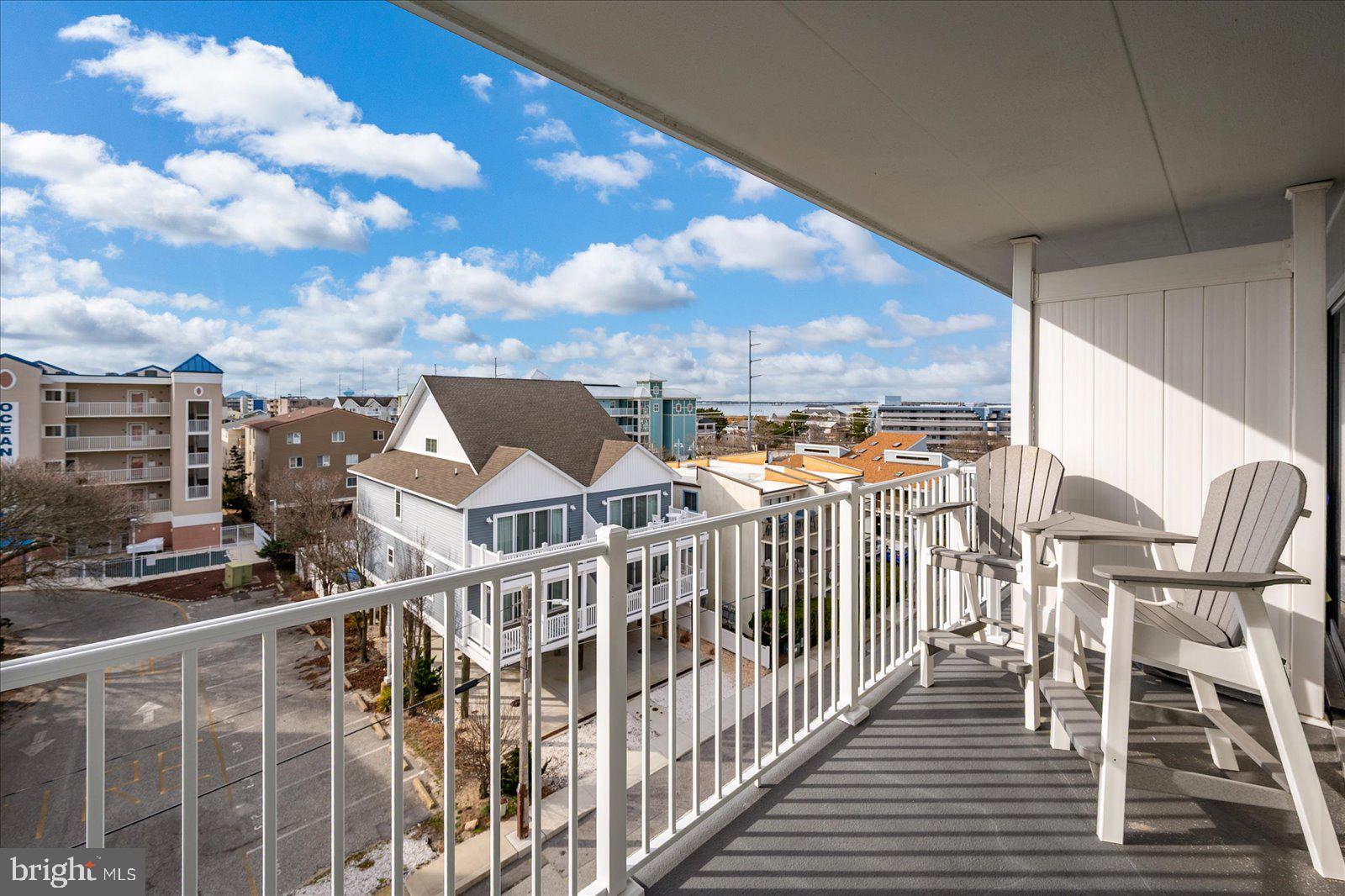 2 80th Street, Unit 504 Ocean City, MD 21842 - Photo 33 of 50 a view of a balcony with wooden chairs