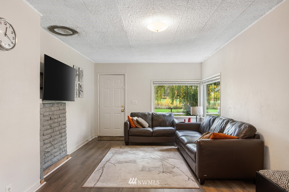7838 South Langston Road Seattle, WA 98178 - Photo 16 of 27 a living room with furniture and a flat screen tv