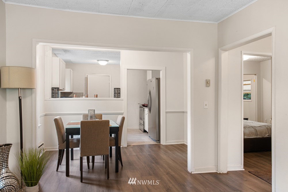 7838 South Langston Road Seattle, WA 98178 - Photo 18 of 27 a view of a dining room with furniture and wooden floor