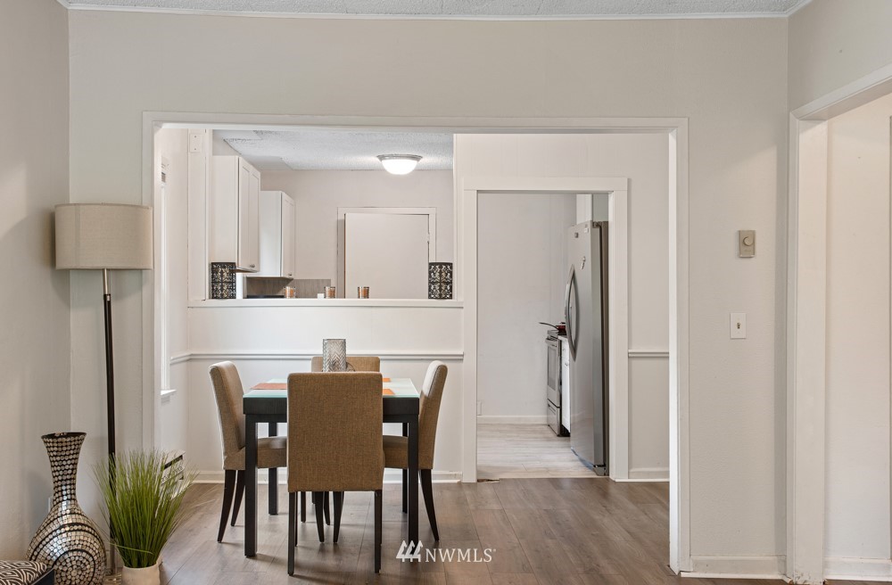 7838 South Langston Road Seattle, WA 98178 - Photo 19 of 27 a view of a dining room with furniture and wooden floor