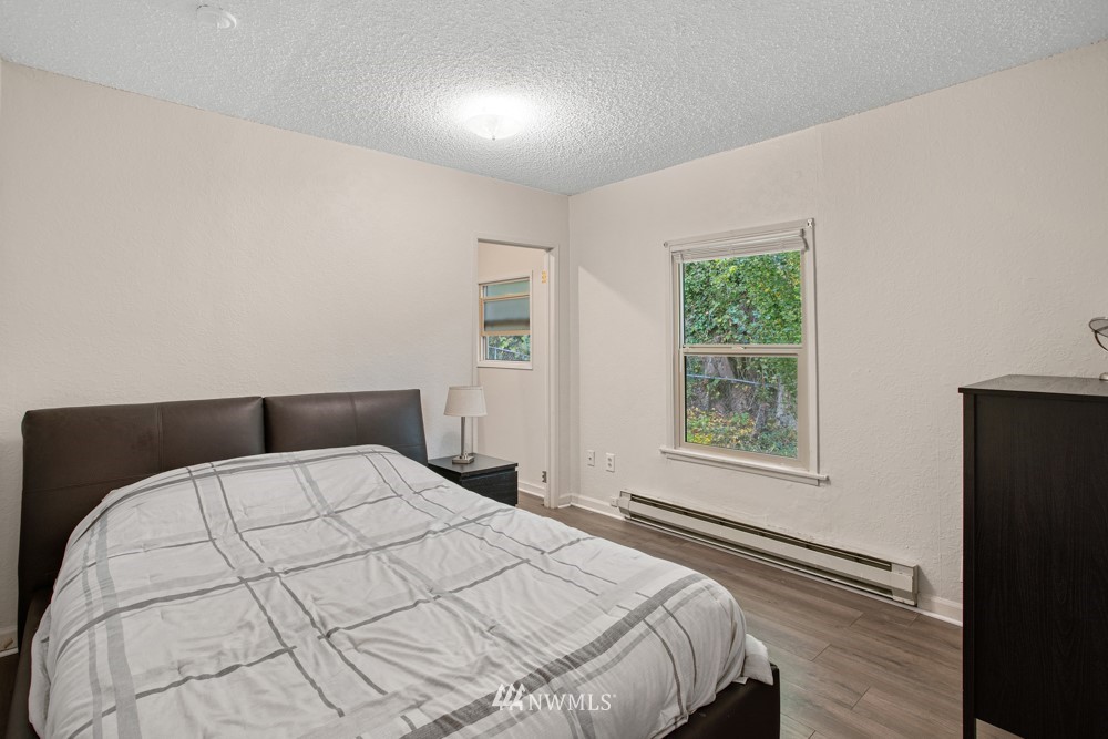 7838 South Langston Road Seattle, WA 98178 - Photo 25 of 27 a bedroom with a large bed and a window
