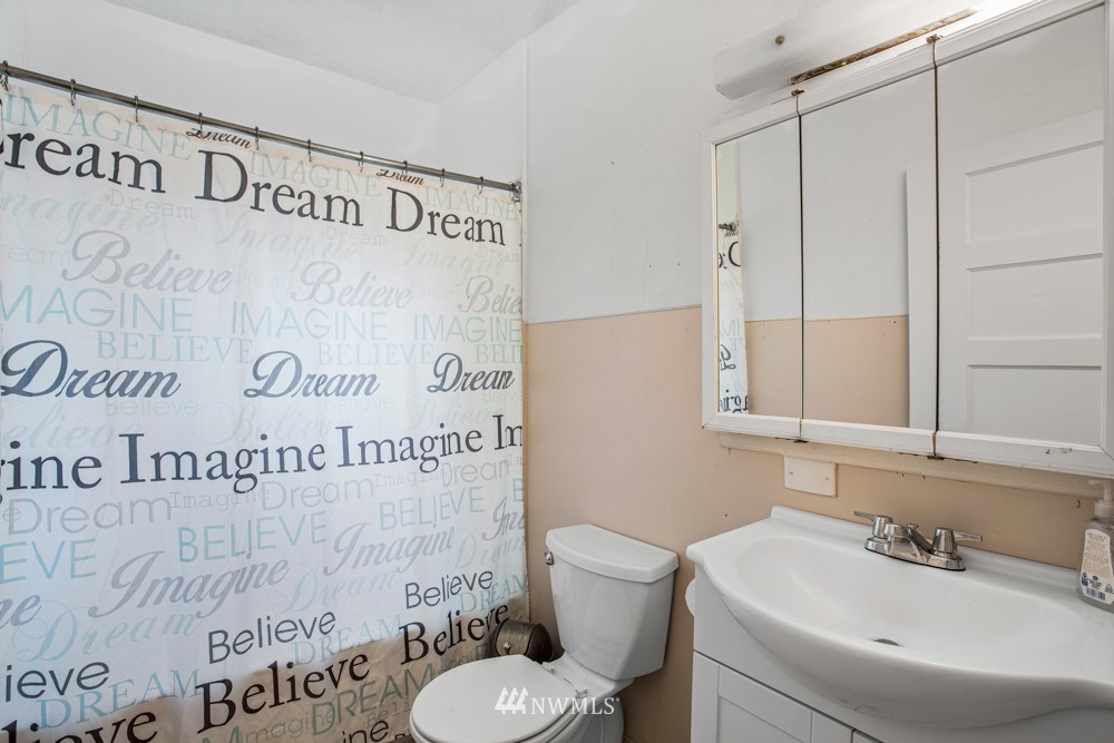 7838 South Langston Road Seattle, WA 98178 - Photo 26 of 27 a bathroom with a sink and a toilet