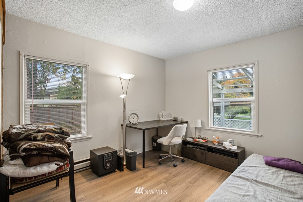 7838 South Langston Road Seattle, WA 98178 - Photo 27 of 27 a bedroom with furniture and a window