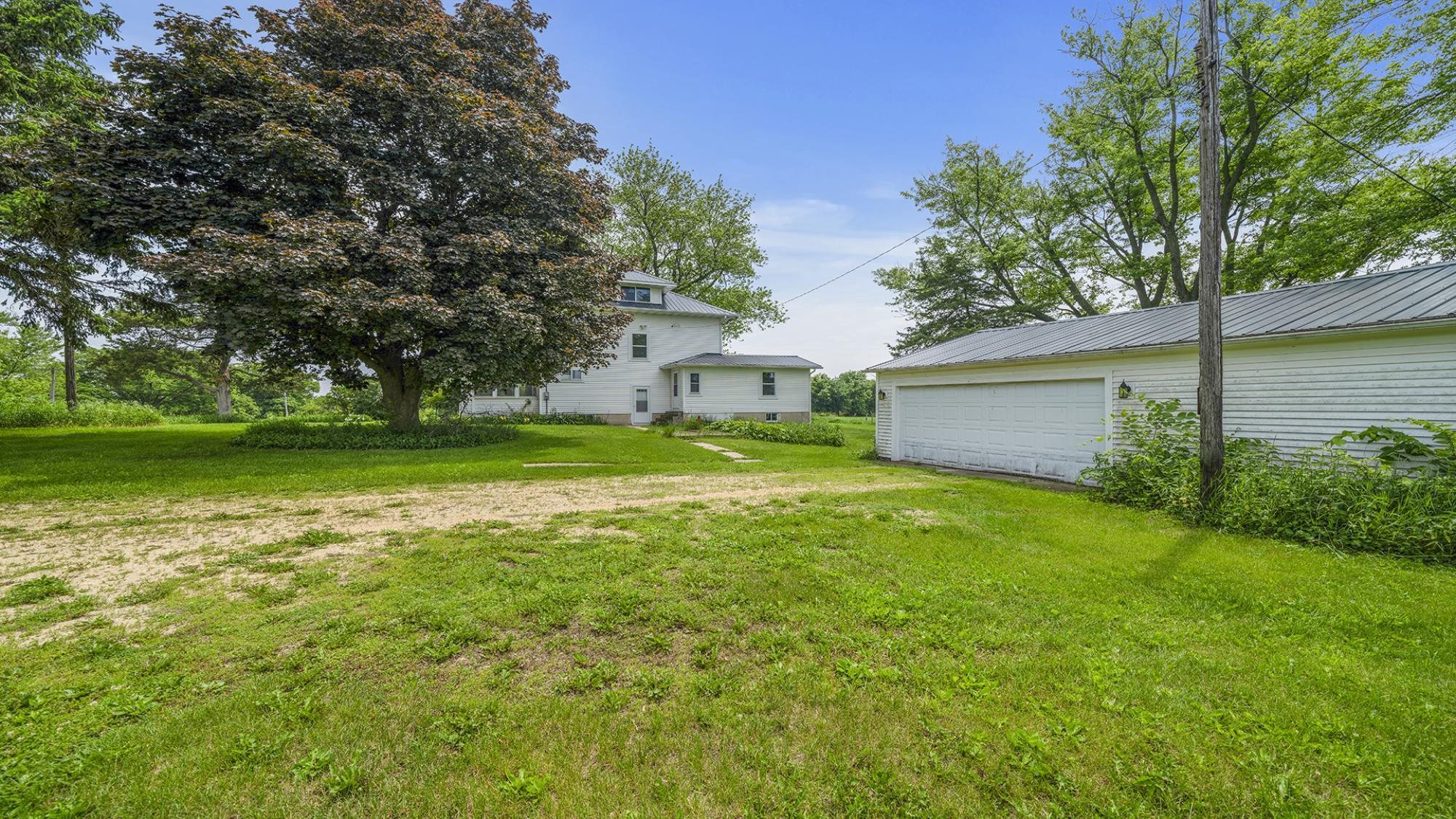 4407 East River Road Ridott, IL 61067 - Photo 25 of 45 a view of a backyard with a garden